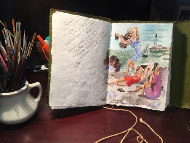 An open book with a picture of a woman on it